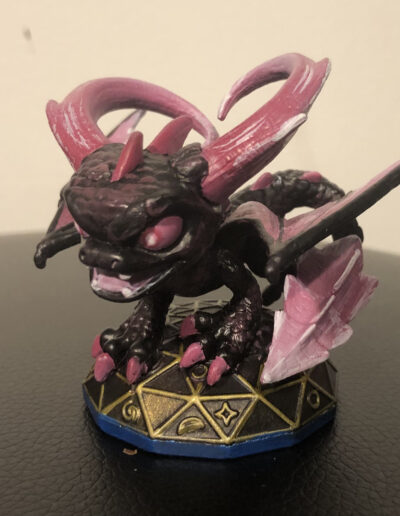 A custom repaint of Series 3 Spyro from skylanders. Character is painted to mimic the "evilized" enemies found in the game.