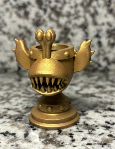 A custom racing trophy designed after the chompy ememies. Trophy is to scale with the official racing trophies found in "Skylanders Superchargers"
