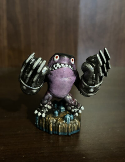 A repaint of Series 3 Terrafin From Skylander. Color scheme switches the character from a brown to purple scheme.