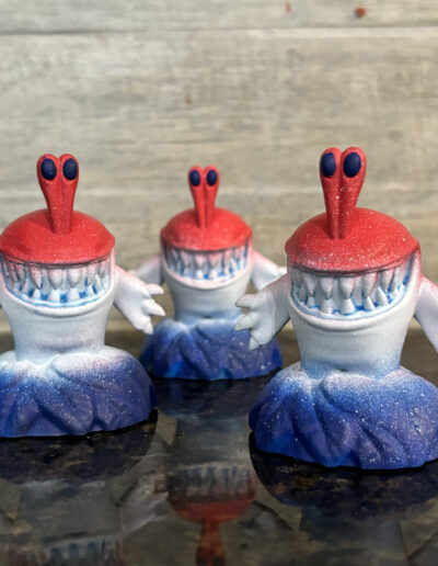 Figure of a Chompy figure, one of the most common enemies found in the skylander series. The Chompy is a rocket pop variant made for the 4th of July.