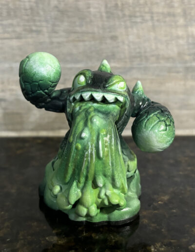 A repaint of a series 3 Eruptor figure, using colors to give it a radioactive look.